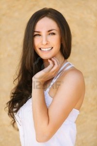 brunette woman pics zigf portrait young beautiful smiling brunette woman wearing white dress against yellow background photo